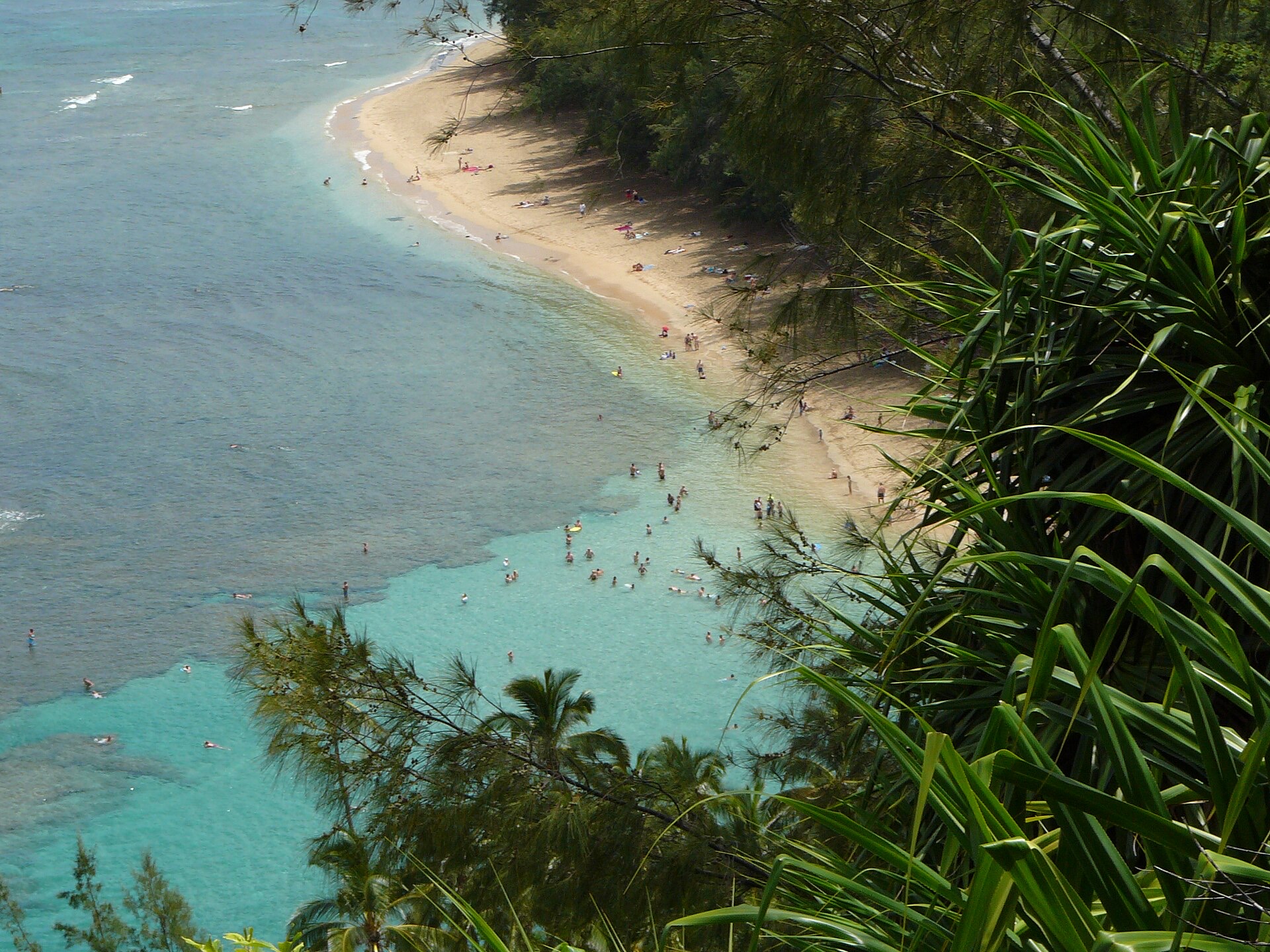 Kee Beach and its reef lagoon at the end of the north shore road, seen from the Kalalau Trail